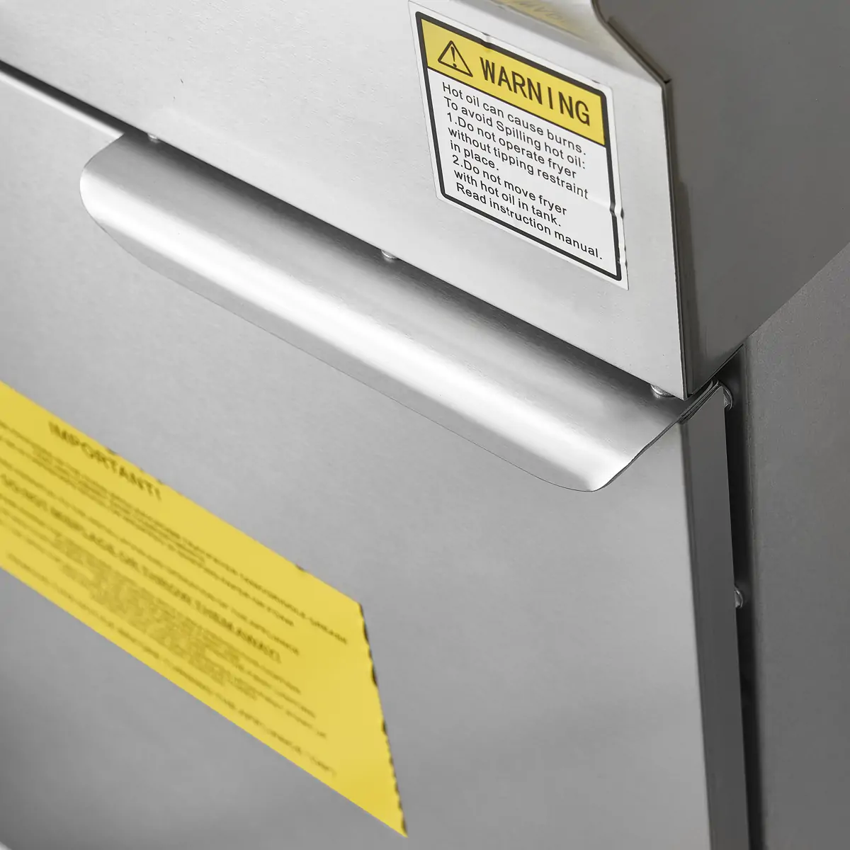 Stainless steel cabinet door handle detail of commercial gas fryer
