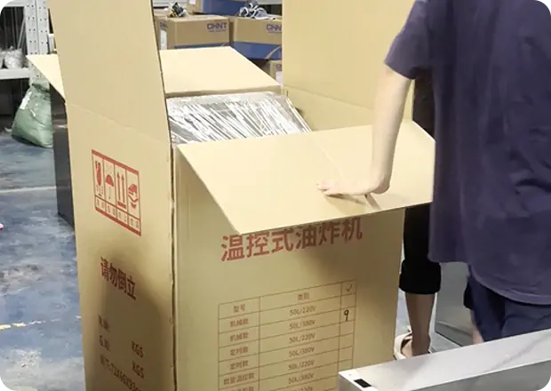 Packaging and logistics team coordinating global shipment of commercial frying equipment