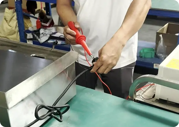 Quality inspection specialists ensuring consistency in commercial fryer production