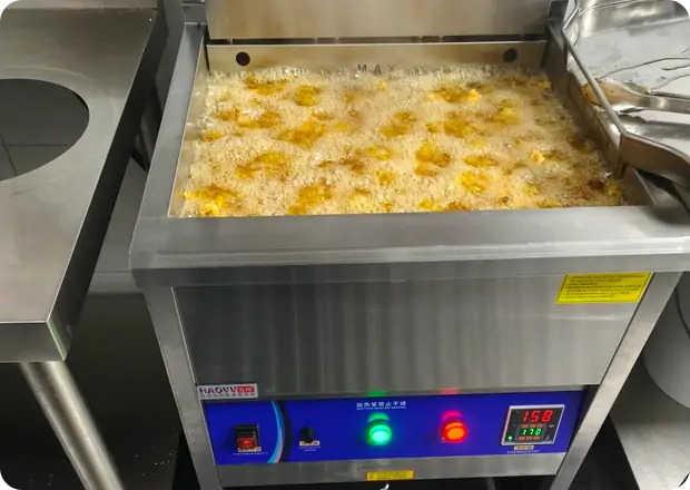 Commercial electric fryer product development process in professional R&D workshop
